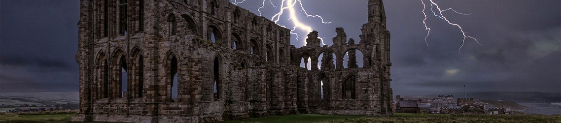 Whitby Abbey in stormy skys with lightning strike