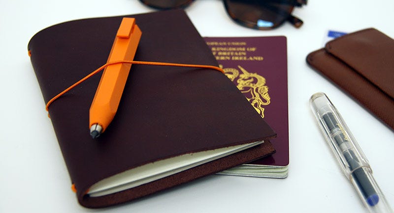 Budget Travel Essentials: Paper Republic Grand Voyageur Travel Notebook in Chestnut & Worther Shorty Pencil in Orange