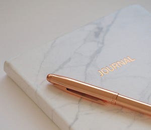 Marbled journal with rose gold pen