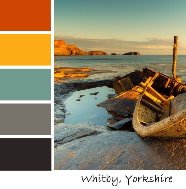 A boat ruin on Whitby beach at sunset